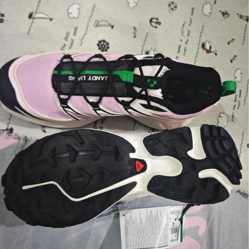 Salomon Pink and Black Women's Trail Sneakers with Green Pull Tabs